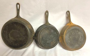 lot 302 image: Three Rusty Cast Iron Skillets