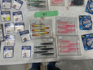 TABLE FULL  OF FISHING PLASTICS AND TRILENE LINE
