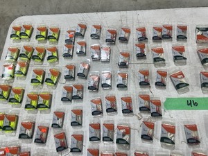 LARGE TABLE FULL  OF FISHING PLASTICS AND TRILENE LINE