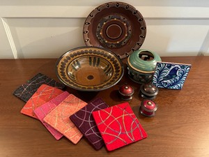 lot 128 image: Artisan Pottery and Recycled Wool Coasters by Penny Norman