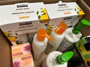 lot 14 image: Large Box of Soap  Body Wash  Conditioner - Kirkland Shea Alba Rainbath Caress Dove