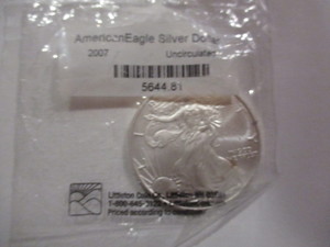 lot 38 image: 2007 American Silver Eagle in Littleton sealed bag