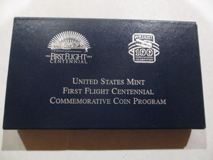 lot 64 image: 2003-P Proof First Flight Commerorative Silver Dollar in Original Government Packaging