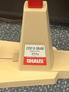 lot 87 image: Cent-O-Gram OHAUS HANGING BALANCE 311G. Missing stainless-steel pan, but it perfect working condition.