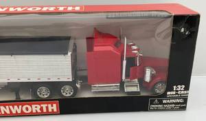 lot 205 image: Newray Brand 132 Scale Die-Cast Kenworth Long Hauler  (Pre-Owned Displayed With Original Box)