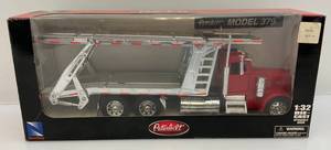 lot 208 image: Newray Brand 132  Scale Die-Cast  Peterbilt Model 379 Car Hauler (Pre-Owned Displayed With Original Box)
