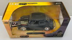 lot 213 image: 2006 Jada Toys Die-Cast 124 Scale Dub City Old Skool 1969 VW Beetle (NIB)