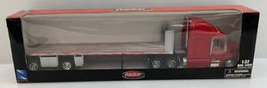 lot 218 image: Newray Brand 132  Scale Die-Cast  Peterbilt 387 Flat Bed Hauler  (Pre-Owned Displayed With Original Box)