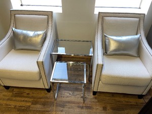 Two Modern Arm Chairs and 3 Glass and Metal Nesting Tables