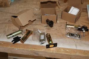 lot 1084 image: Lot of (3 Boxes) Assorted Dead Bolt Lock Parts