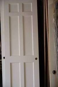 lot 1104 image: Solid Core 6-Panel Door 31-34x94