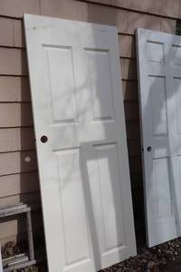 lot 1110 image: Solid Core 4-Panel Door 31-34x80