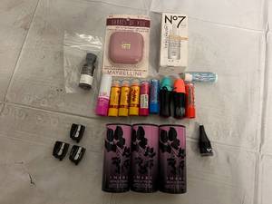 lot 36 image: Lipstick Resurfacing Peel, Body Powder, and Other Cosmetics