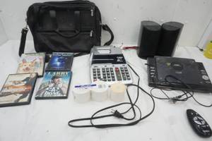 lot 26 image: Leather Briefcase, Movies, iPod Shuffle, Coby Radio system with remote, calculator with Paper