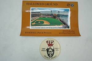 lot 87 image: Vintage MN Twins Calendar and Vintage Hank Aaron Button