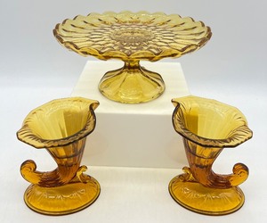 lot 241 image: Vintage ANCHOR HOCKING Glass Amber Cake Plate and 2 FENTON Amber Glass Cornucopia
