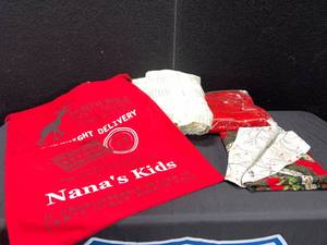 lot 1595 image: NANAS KIDS CLOTH GIFT SACK, BLANKETS AND REVERSIBLE TABLE RUNNER