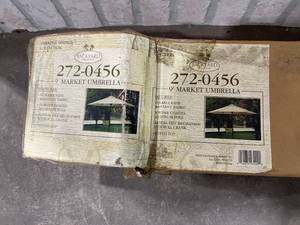 lot 1486 image: NINE FOOT OUTDOOR UMBRELLA NEW OLD STOCK