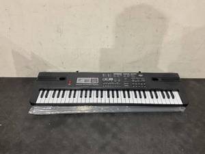 lot 228 image: WOSTOO Kids Piano Keyboard, 61 Keys Multi-Function Electronic Keyboard