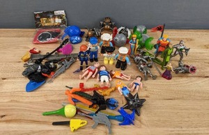 lot 99 image: Mixed Lot of Plastic Toy Characters Playmobil, Lego Duplo, Bakugan Battle Brawlers, Lakeshore Royal Kingdom Adventure Figures and More E