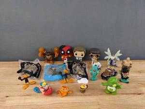lot 115 image: Assorted Figurines includes Care Bears,  FunKo Pop The Office, Deadpool, Harry Potter and More E