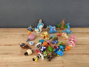 lot 91 image: Assorted Small ToysFigurines - Pokemon, Star Wars, Care Bears, and more E