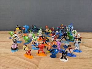 lot 111 image: An Assortment of Cartoon Disney Character Cake Toppers E