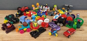 lot 121 image: Assortment of Vintage Kids Toys Cartoon Characters, Cars, Batman Batmobile, Disney Pixar Cars 2 Holly Shiftwell, Looney Tunes Tasmanian Jeep, Toy Pick Up and More E