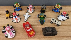lot 125 image: Assortment of Kids Toys Mario Kart Toad, Mario & Bowser Vehicles, Disney Pixar Cars Lightning McQueen, Teenage Mutant Ninja Turtles Slot Car, Etc. E