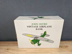 lot 19 image: John Deere Vintage Airplane Bank Lockheed Vega 5B B