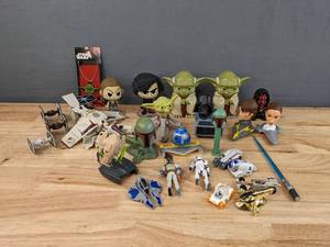 lot 39 image: Collection of Star Wars Figurines, Two Funko Pop Bobble Heads and More Memorabilia E
