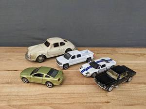 lot 87 image: (5) Assorted Die CastToy Cars - White Porsche, 2014 Chevy Silverado, 2006 Ford GT, 2003 Ford Mustang, 1964 12 Ford Mustang E