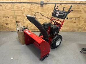 lot 143 image: TROY-BILT STORM 2890 Snow Blower- parts machine