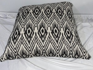 lot 99 image: Black and Cream Patterned Pillow