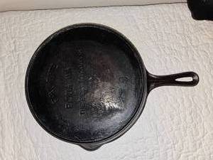lot 27 image: Three Vintage Cast Iron Skillets including Wagner