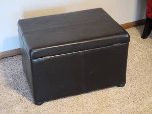 lot 100 image: Black Faux Leather Storage Ottoman