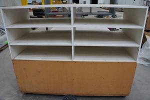 lot 22 image: Large Rolling Double Sided Wood Cabinet