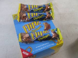 lot 231 image: (B-1) Box of 24 Flipz Clusterz Candy Bars Past Date