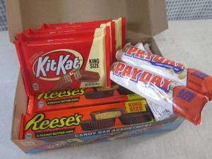 lot 317 image: (C-1) Box of 12 King Size Candy Bars 4 Each of Kit Kat, Pay Day and Reeses Peanut Butter Cups Best by Date Vary March - Aug 2024