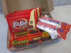 lot 320 image: (C-1) Box of 12 King Size Candy Bars 4 Each of Kit Kat, Pay Day and Reeses Peanut Butter Cups Best by Date Vary March - Aug 2024