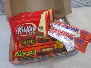 lot 321 image: (C-1) Box of 12 King Size Candy Bars 4 Each of Kit Kat, Pay Day and Reeses Peanut Butter Cups Best by Date Vary March - Aug 2024