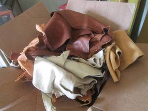 lot 30 image: (DLR) Box Full of Assorted Leather Pieces