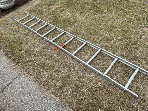 lot 251 image: Eleven Foot Aluminum Ladder