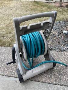 lot 280 image: Suncast Hose Reel with Garden Hose