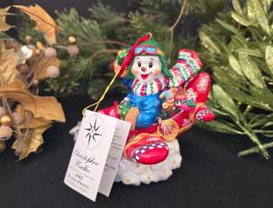 lot 215 image: Christopher Radco 2002 Flying Frosty Figure Plus Holiday Foliage
