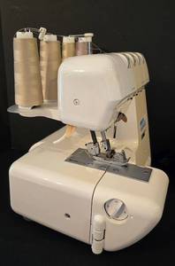 lot 231 image: Superb Superlock Electronic Serger & Thread