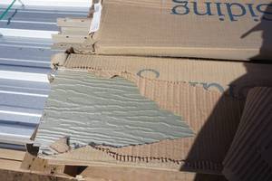 lot 55 image: 5 Boxes 60 Pieces Rollex Navigator 8 Steel Siding Norwegian Wood Color