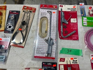 TABLE FULL OF AUTO SPECIALTY TOOLS
