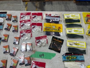 TABLE FULL OF FISHING PLASTICS