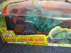 lot 124 image: Dino Monster Truck and Velociraptor new in box